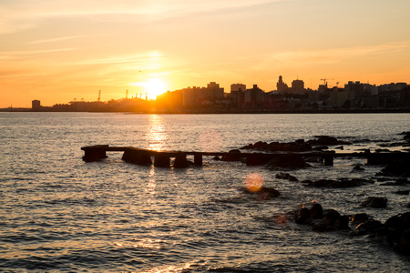Sunset over Rio de la Plata with Montevideo skyline in the backgroundの写真素材
