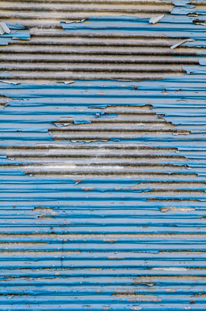 Full frame take of corrugated iron with peeling paintの写真素材