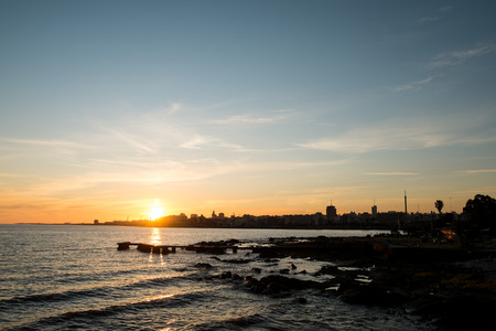 Sunset over Rio de la Plata with Montevideo skyline in the backgroundの写真素材