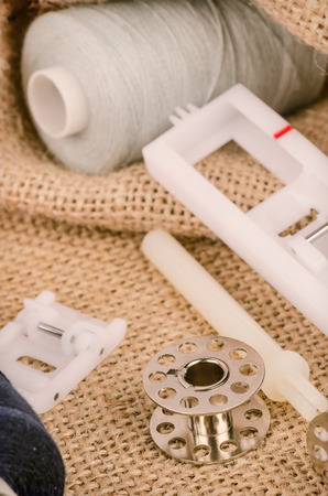Sewing machine parts in a still life with yarn spoolsの写真素材