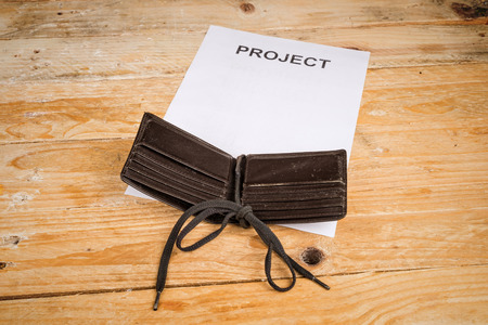 On a shoestring, a tight finances concept