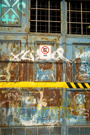 Old garage door with a lot of wear and tearの写真素材