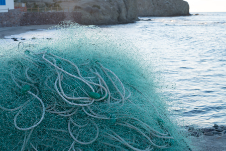Traditional fishing nets in a small harborの写真素材