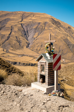 Roadside shrine at high altitude on an Andean dirt road in Salta province, Argentinaの写真素材