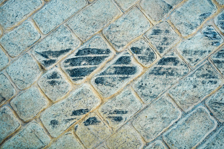 Fesh tire marks on a cobblestone streetの写真素材