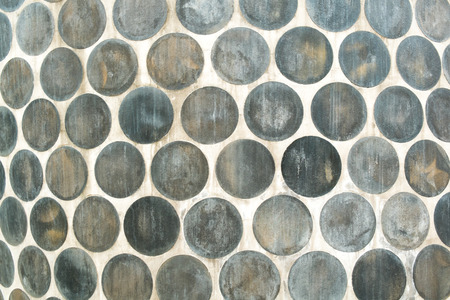Full frame take of a patern of circular clay tiles