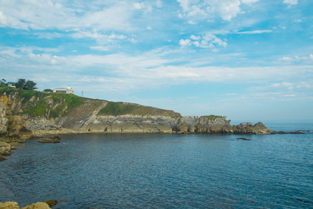 Rocky coast around San Vicente de la Barquera lighthouse, Cantabria, Spainの写真素材