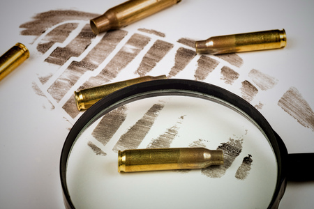 Footprint and bullet shells  on a crime scene, a conceptの写真素材
