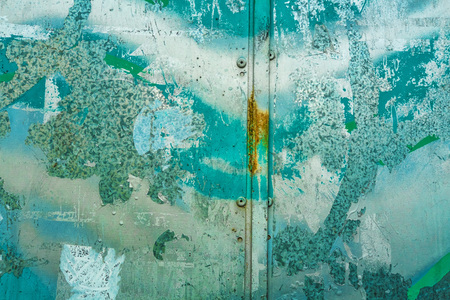 Texture of an old blue and green peeling metal sheet