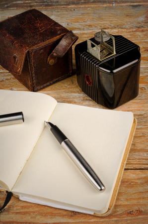 Still life with vintage camera, fountain pen and notebook, a journalism conceptの写真素材