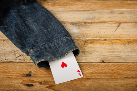 Card up the sleeve, a conceptual shot on cheating and dishonestyの写真素材