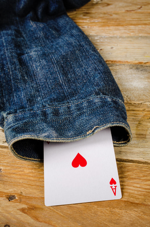 Card up the sleeve, a conceptual shot on cheating and dishonesty