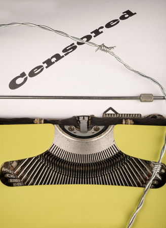 Old typewriter and text as a concept on the ever more threatened freedom of pressの写真素材