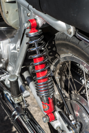 Rear wheel shock absorber on a vintage motorcycleの写真素材