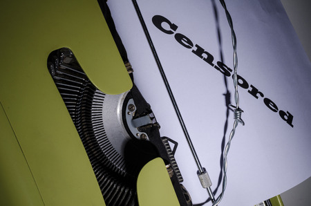 Press freedom concept with an old typewriter and barbed wireの写真素材