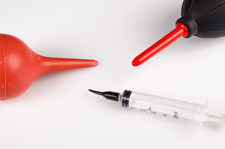Syringe, bulb syringe and blower, a precision cleaning setup as used to clean electronics like camera sensors. の写真素材
