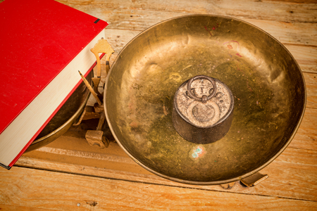 Vintage scales  displaying a concept on educationの写真素材