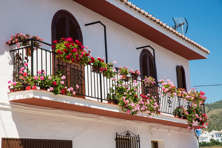 Andalusian  balcony full of flower potsの写真素材