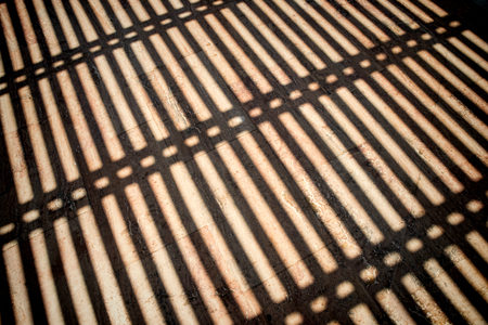 Gate bars as a shadow patternの写真素材