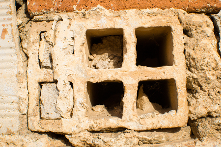 Decaying old brick wall