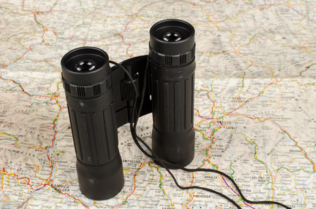 Binoculars on a paper map, a travel and adeventure conceptの写真素材