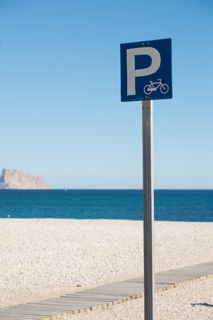 Bicycle parking lot on a sunny Mediterranean beachの写真素材
