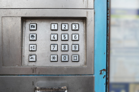 Old phone booth dial or keyboard in a grunge condition
