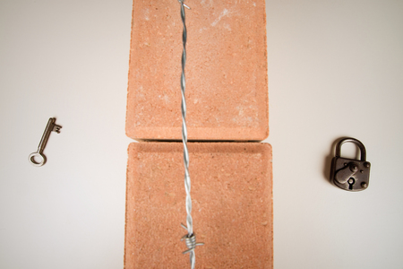 Either side of the wall, a concept on immigration issuesの写真素材