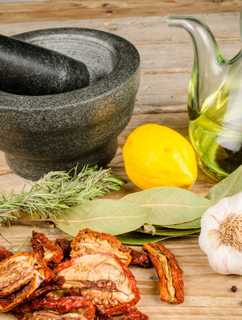 Mortar and pestle surrounded by Mediterranean ingredientsの写真素材