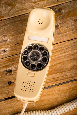 Old phone with its dial incorporated in the handsetの写真素材