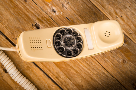 Old phone with its dial incorporated in the handsetの写真素材