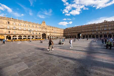 SALAMANCA, SPAIN- MAY 29, 2019: People enjoying a sunny spring day on Salamancas landmark  Plaza Mayor, Spain.の写真素材