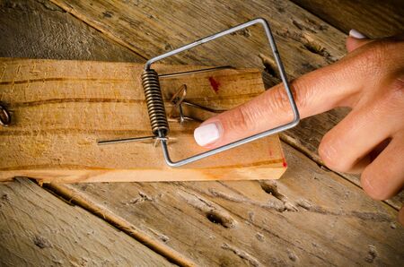 Hands in a mouse trap