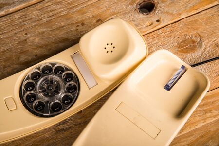 Old phone with its dial incorporated in the handsetの写真素材