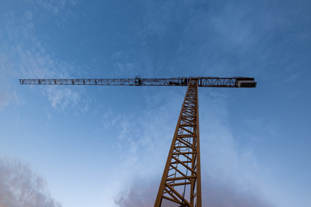 Construction crane in a low angle takeの写真素材