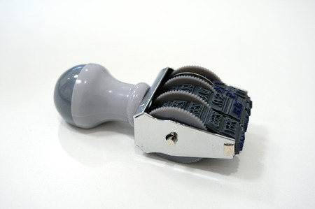 Date months years rubber stamper isolated on white background. The devices used in the officeの写真素材