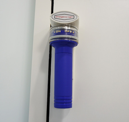Emergency flashlight on the wall use in the buildingの写真素材
