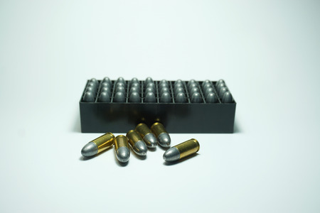 police bullets  9 mm and box on white background
