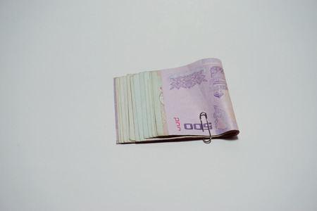 five hundred and  thoundsand baht Thai Money on white backgroundの写真素材