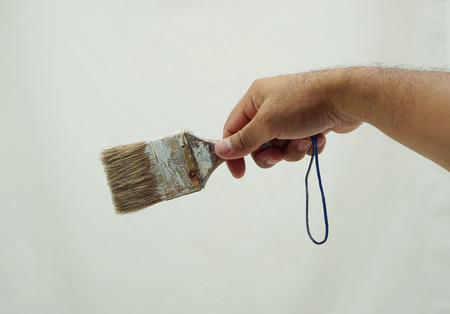 Man holding paintbrush on white background, Close-up handの写真素材