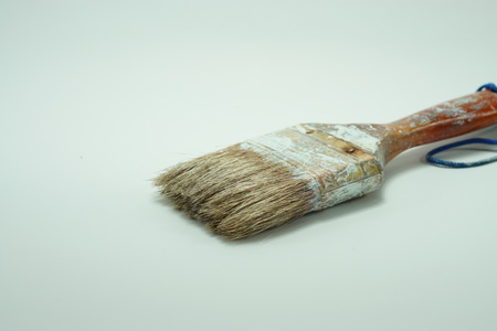 Used and old paint brush isolated on a white backgroundの写真素材