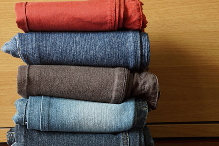     Stack of Multicolor Jeans texture and background                               