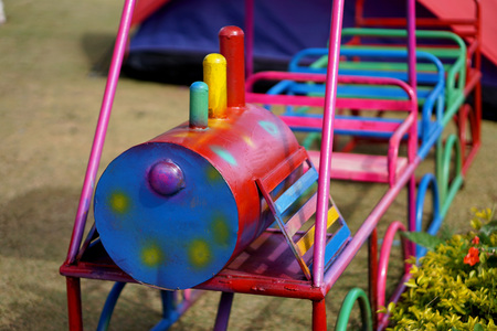 Iron train swinging at the playground under the sunlight in summerの写真素材