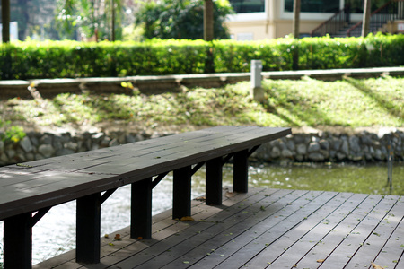 Long wood bench for rest and nature backgroundの写真素材