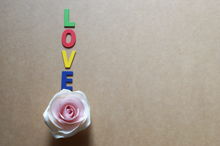  Wood  letter made love word and rose pattern on brown paper background.                                  の写真素材