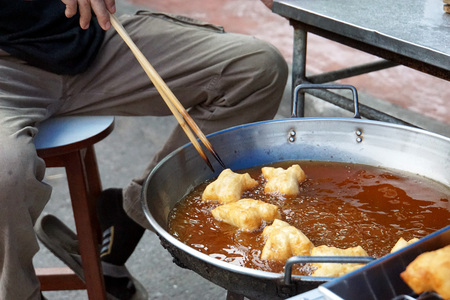 Fried dough for sell in morning market of Thailand.の写真素材