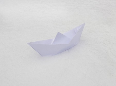 white paper boat on the snow, springの写真素材