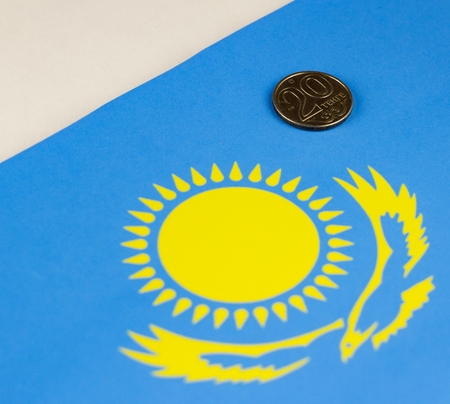 Kazakhstan money against the background of the Kazakh flagの写真素材