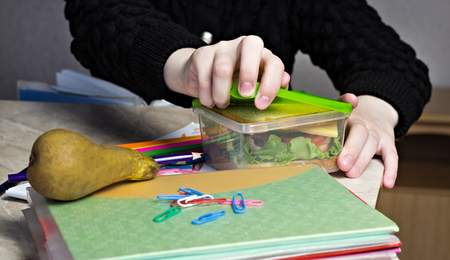 girl at school opens lunch, close upの写真素材
