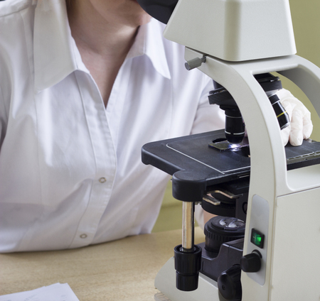 Blood test, hand, glove, microscope, laboratory assistantの写真素材